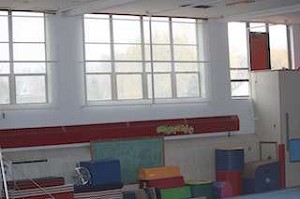 The 1922 school buildings gym has rather large windows. It is now used for gymnastics. (Photo by Tom Westman)